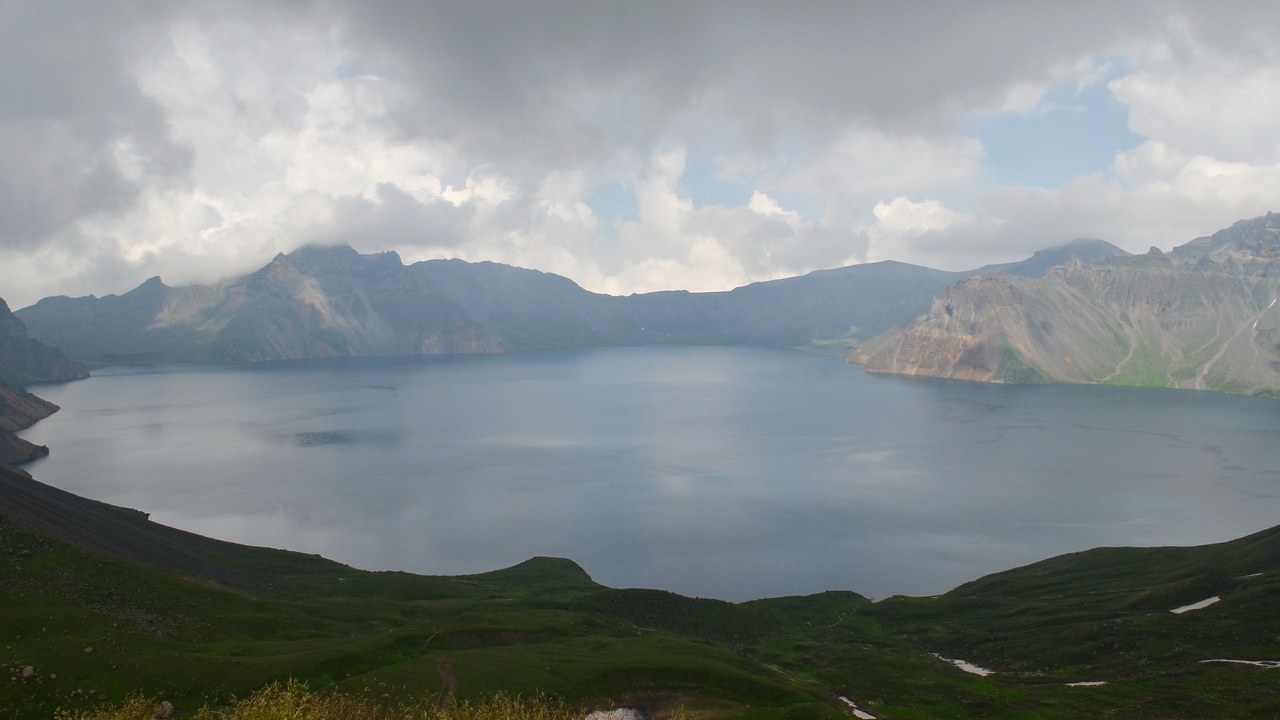 The crater rim and blue water of Heaven Lake at Changbaishan, seen from the west slope.