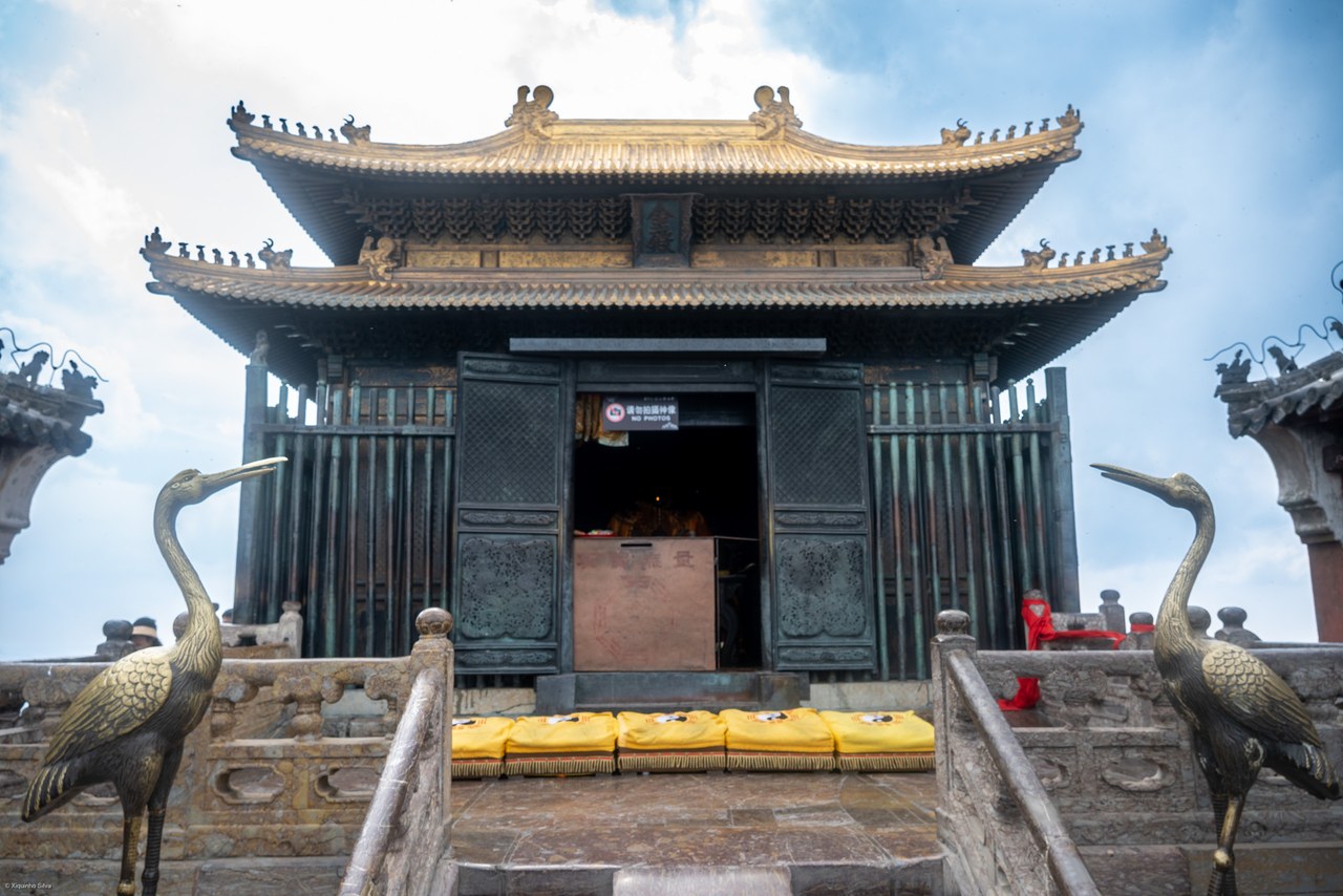 The Golden Hall at Wudangshan, with its ornate roof, stone steps and crane statues.