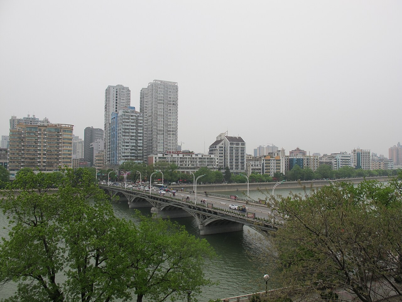 Xinjiang Bridge and the riverfront buildings of central Shangrao