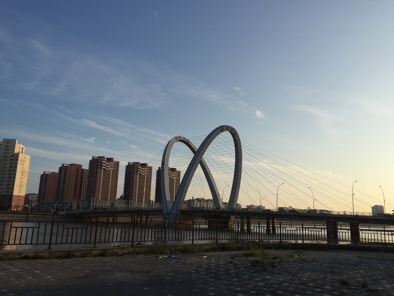 Tianchi Bridge crossing the river in Yanji in late-afternoon light