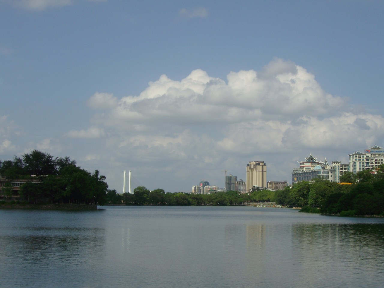 West Lake in Huizhou, with trees and the surrounding inland-city waterfront.