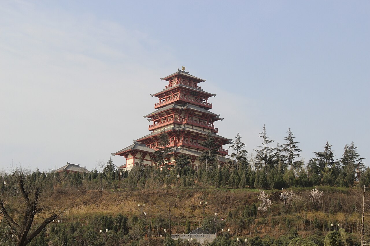 The tiered Shigu Pavilion rising above the wooded hillside in Baoji