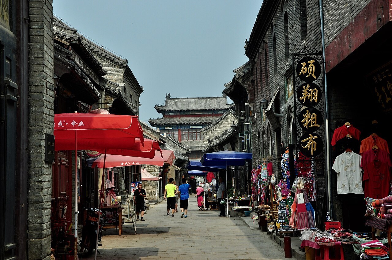 Grey-brick shopfronts along Dajie in Zhoucun, Zibo