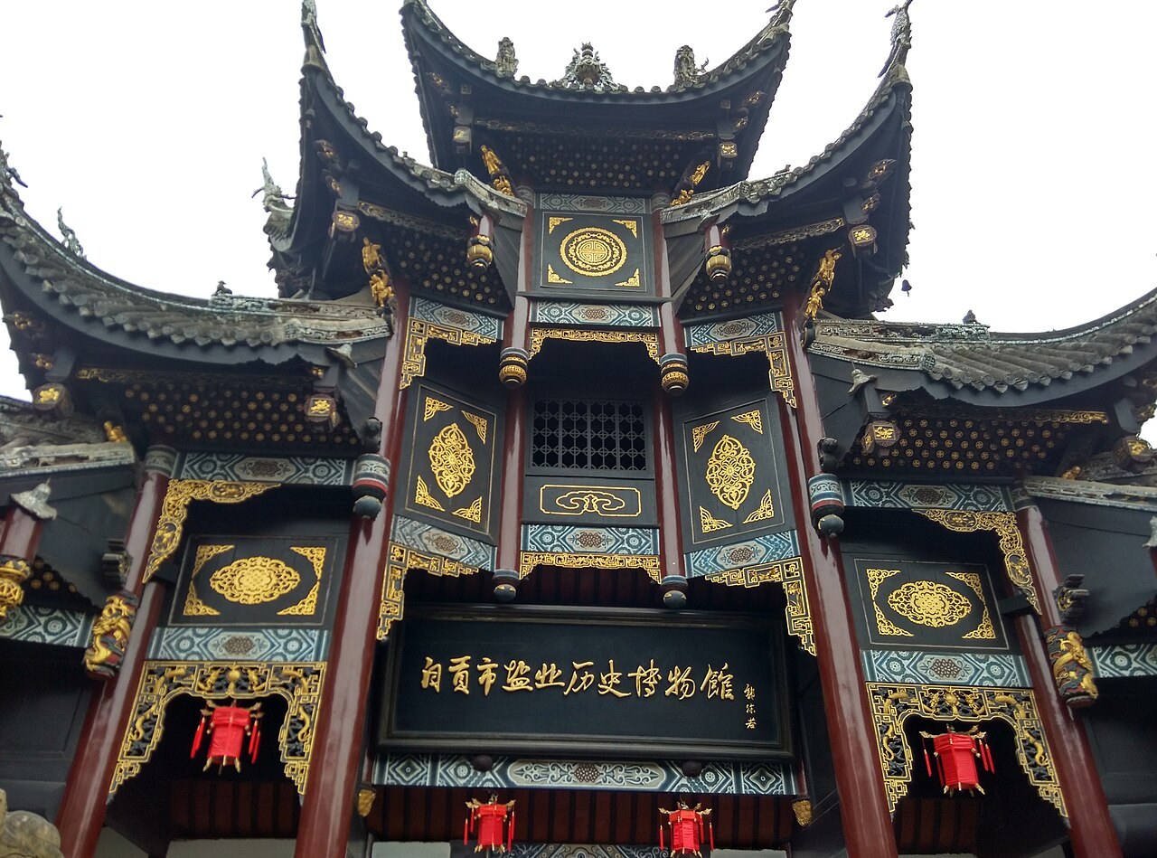 The ornate roof and entrance of Xiqin Guild Hall in Zigong.
