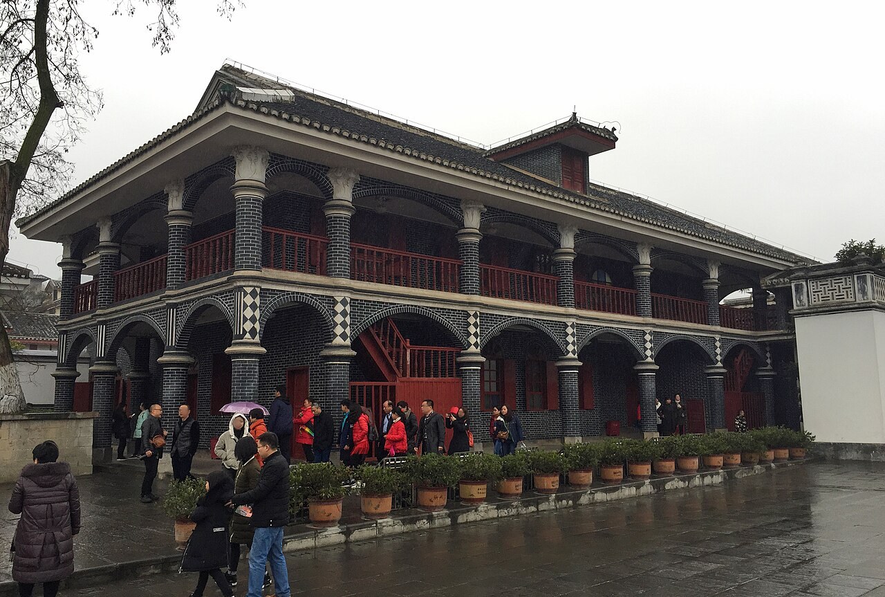 The two-storey Zunyi Conference Site building with visitors outside.