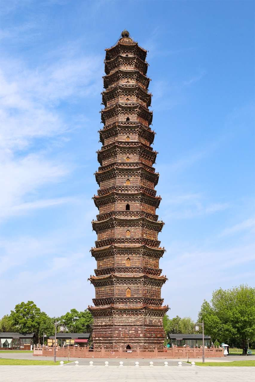 The complete thirteen-storey glazed-brick Iron Pagoda against blue sky