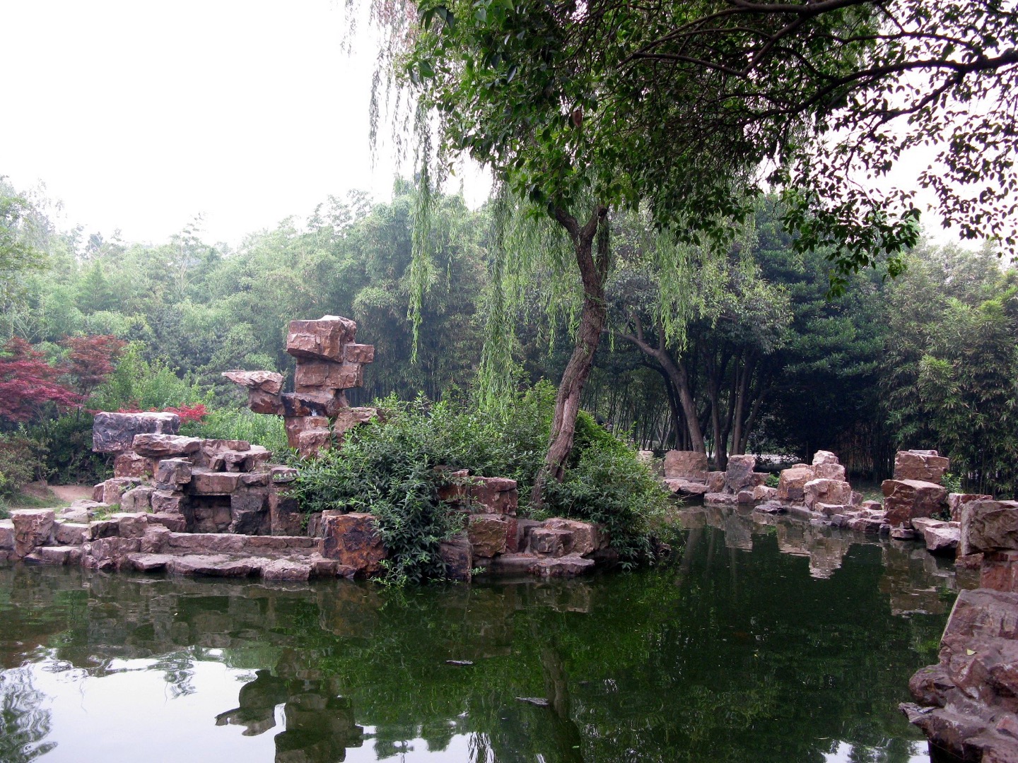 Rockwork, a pond and willow trees in Yangzhou’s Ge Garden.